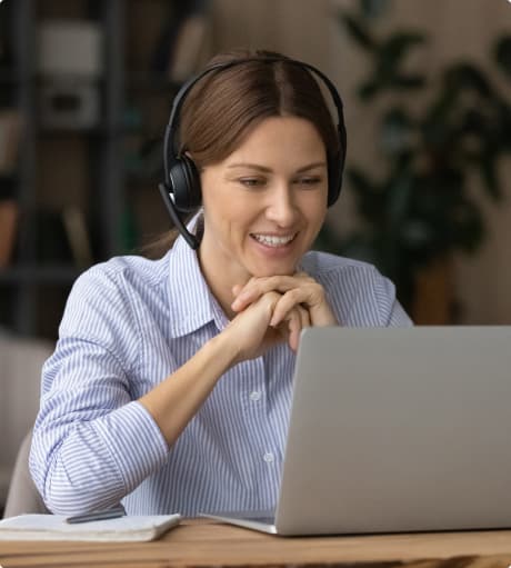 Female receptionist working with laptop