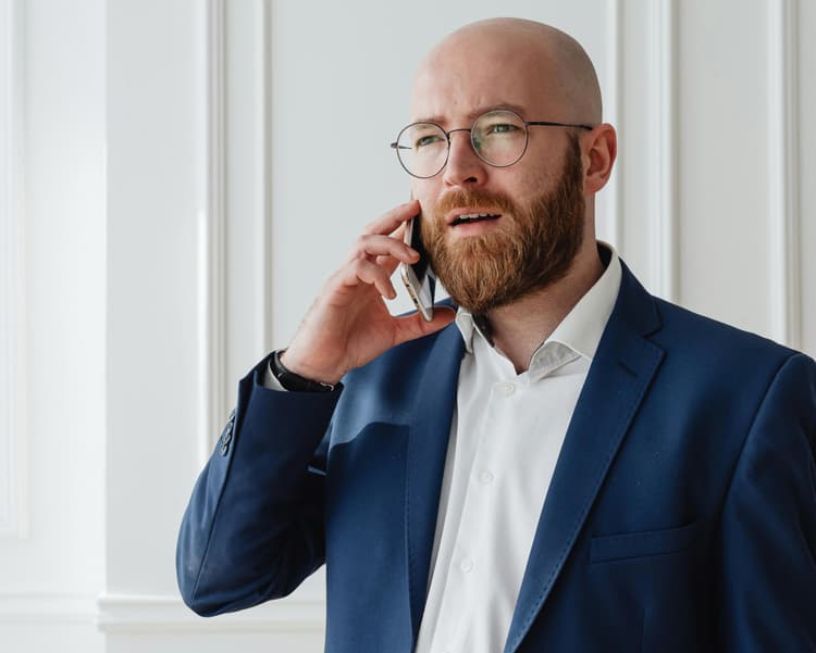 Man with beard on call