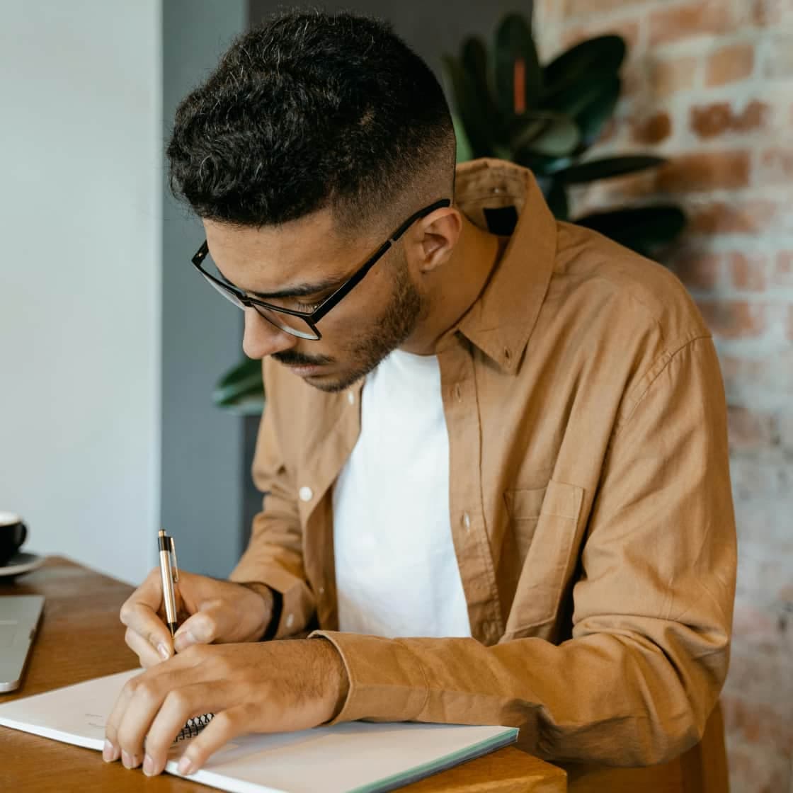 A man writing notes